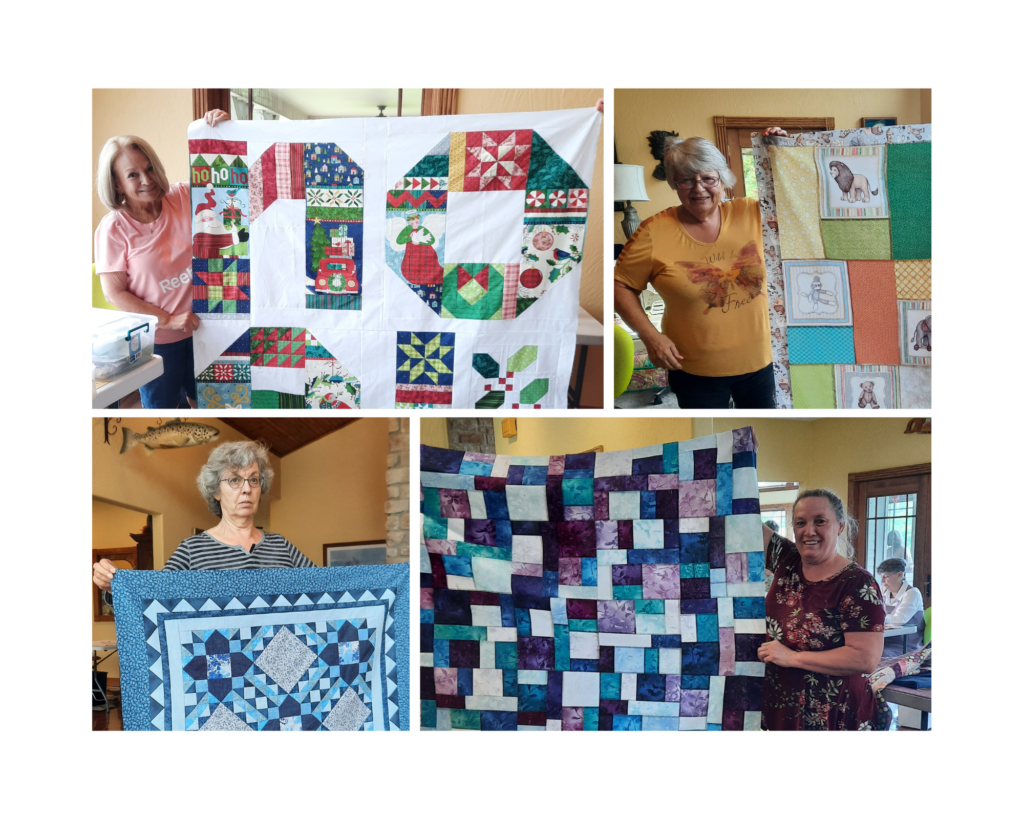 4 quilts completed by some of the ladies attending the retreat